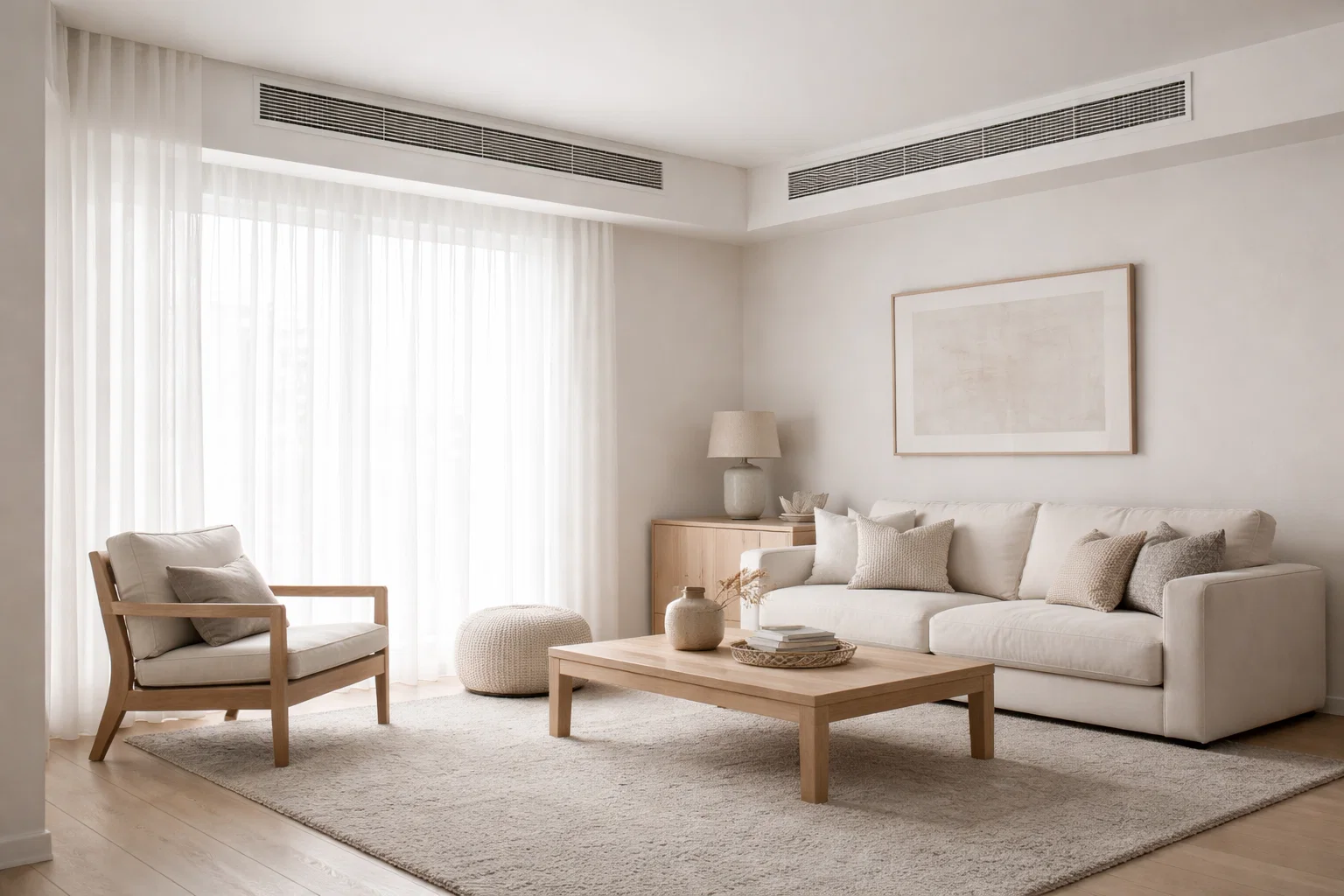 Interior living space with visible air supply vents along the wall, showing how conditioned air is distributed.